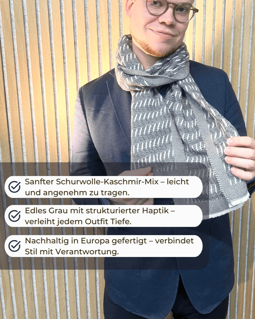 Strukturschal "Soil grey" aus Schurwolle und Kaschmir getragen von einem jungen Mann und Produktvorteilen